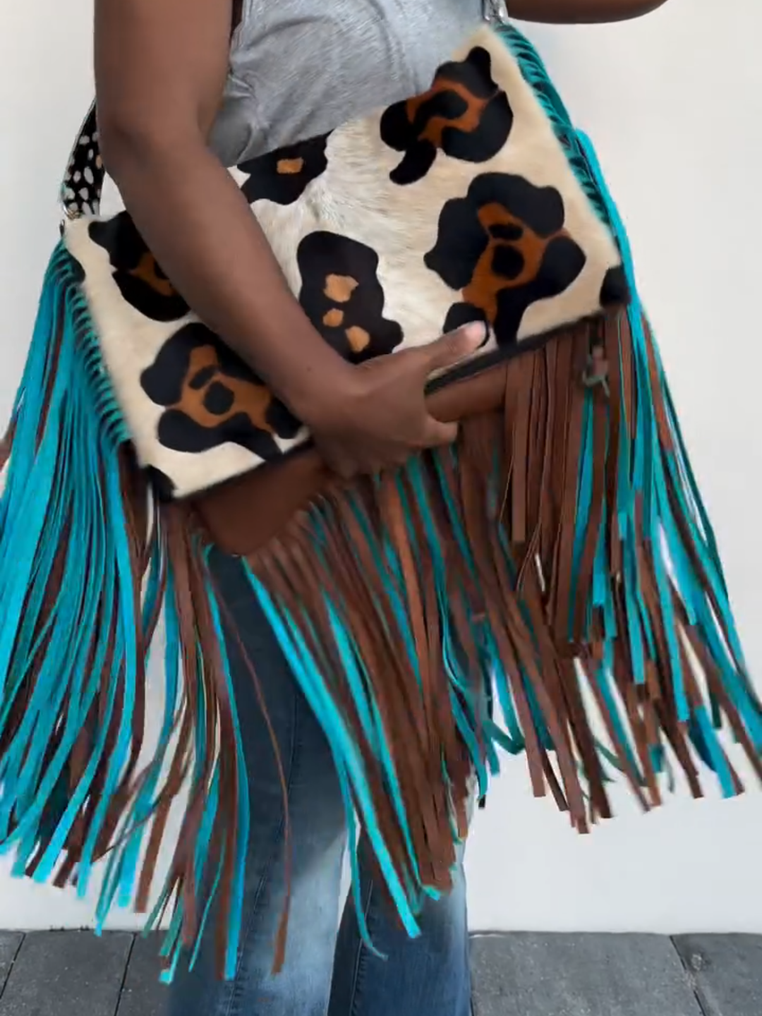 Leopard print tassel clutch crossbody bag
