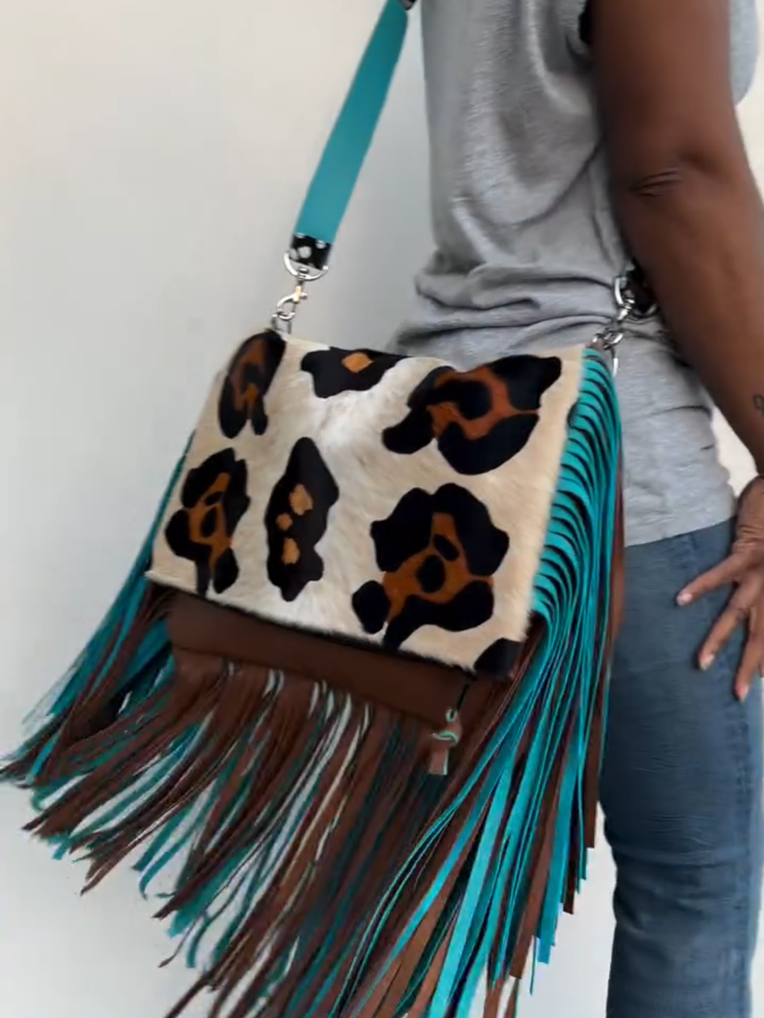 Leopard print tassel clutch crossbody bag