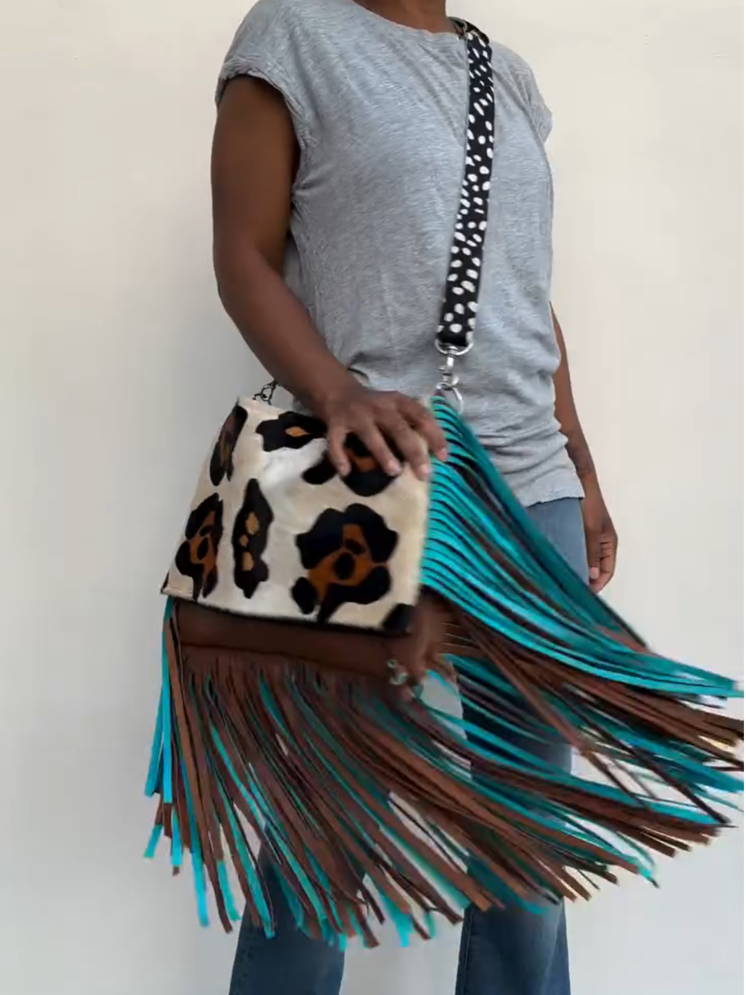 Leopard print tassel clutch crossbody bag