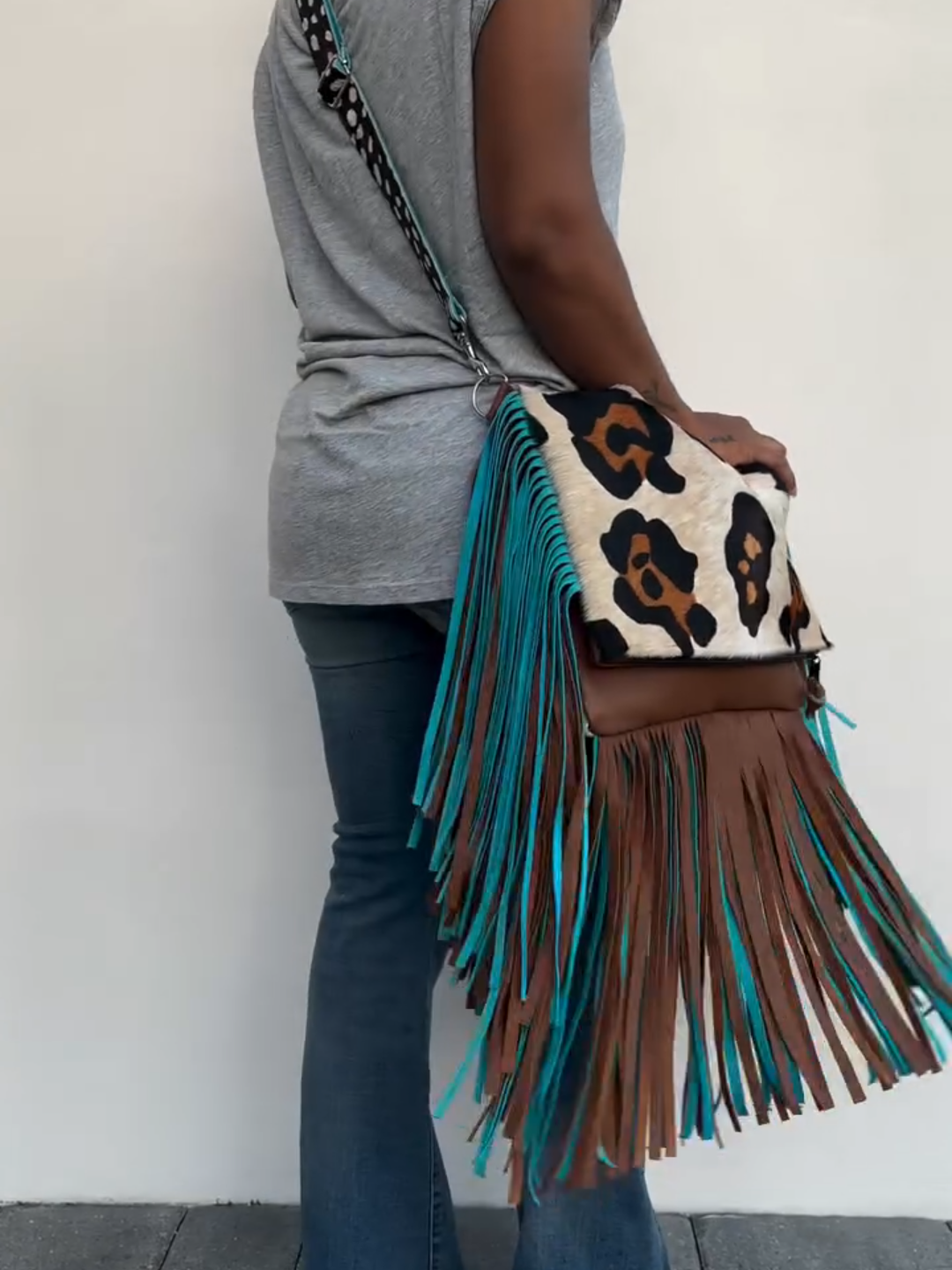 Leopard print tassel clutch crossbody bag