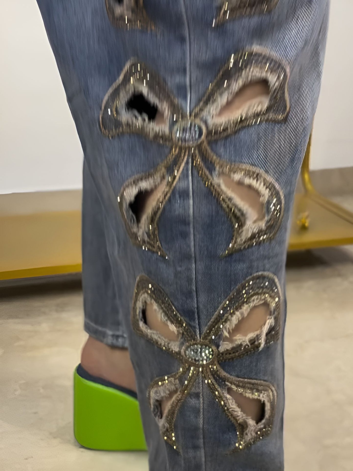 raw-edge pussy-bow jeans