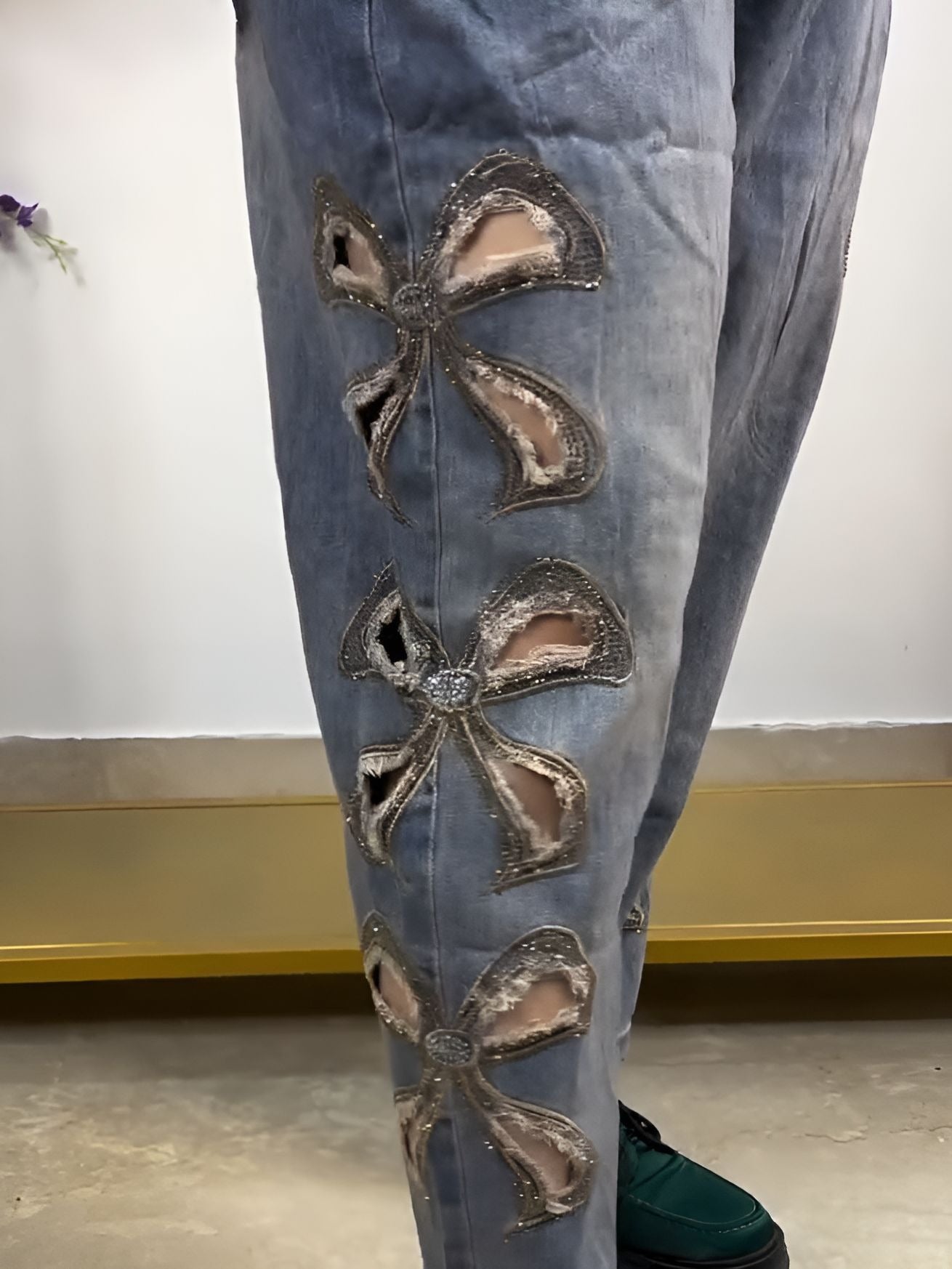 raw-edge pussy-bow jeans