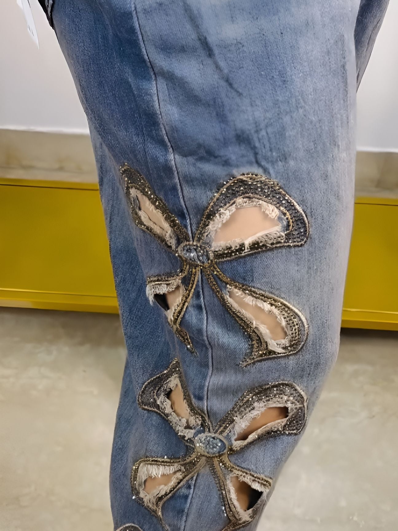 raw-edge pussy-bow jeans