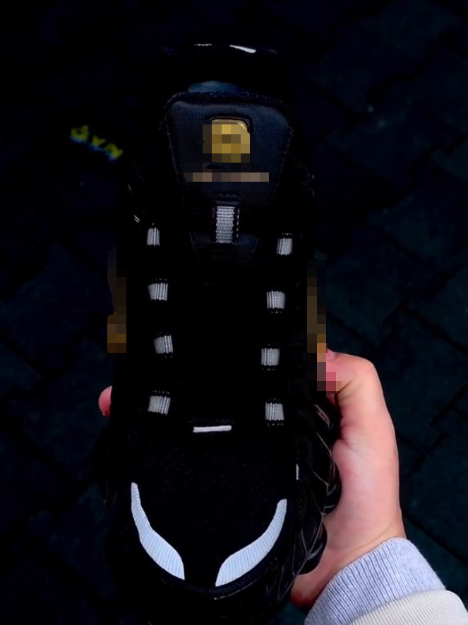 Black sneakers with gold accents
